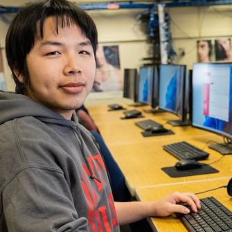 Male student in computer lab.