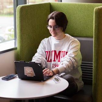 Student working on campus on a tablet