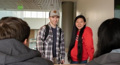 Student at table together.