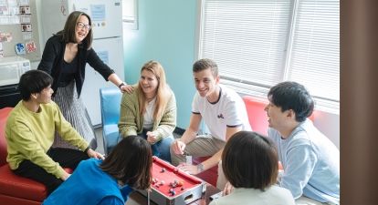 Students with staff smiling